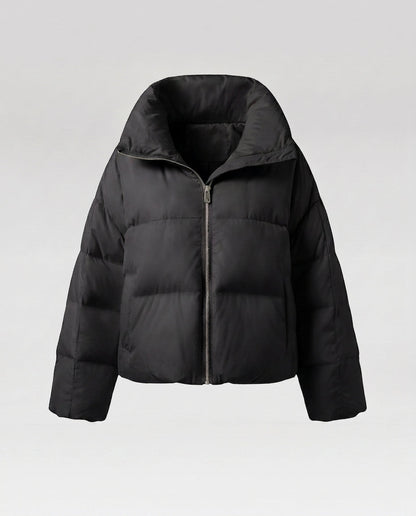 Women's cropped quilted jacket with oversized hood, lightweight thermal filling, and rounded hem