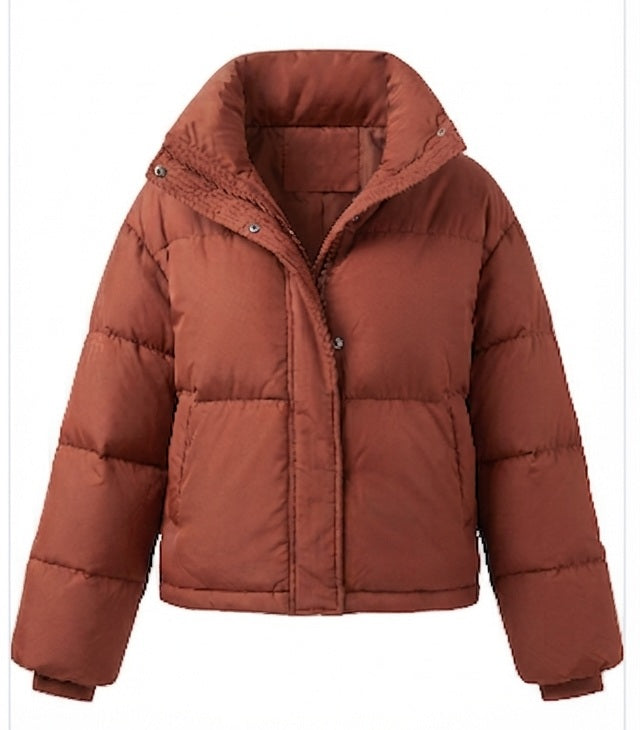Women's compact microfiber puffer jacket with high shawl collar, concealed snap button placket, and adjustable hem