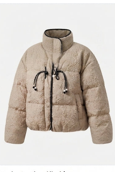 Women's short quilted puffer jacket with high standing collar, textured structure, and decorative drawstrings