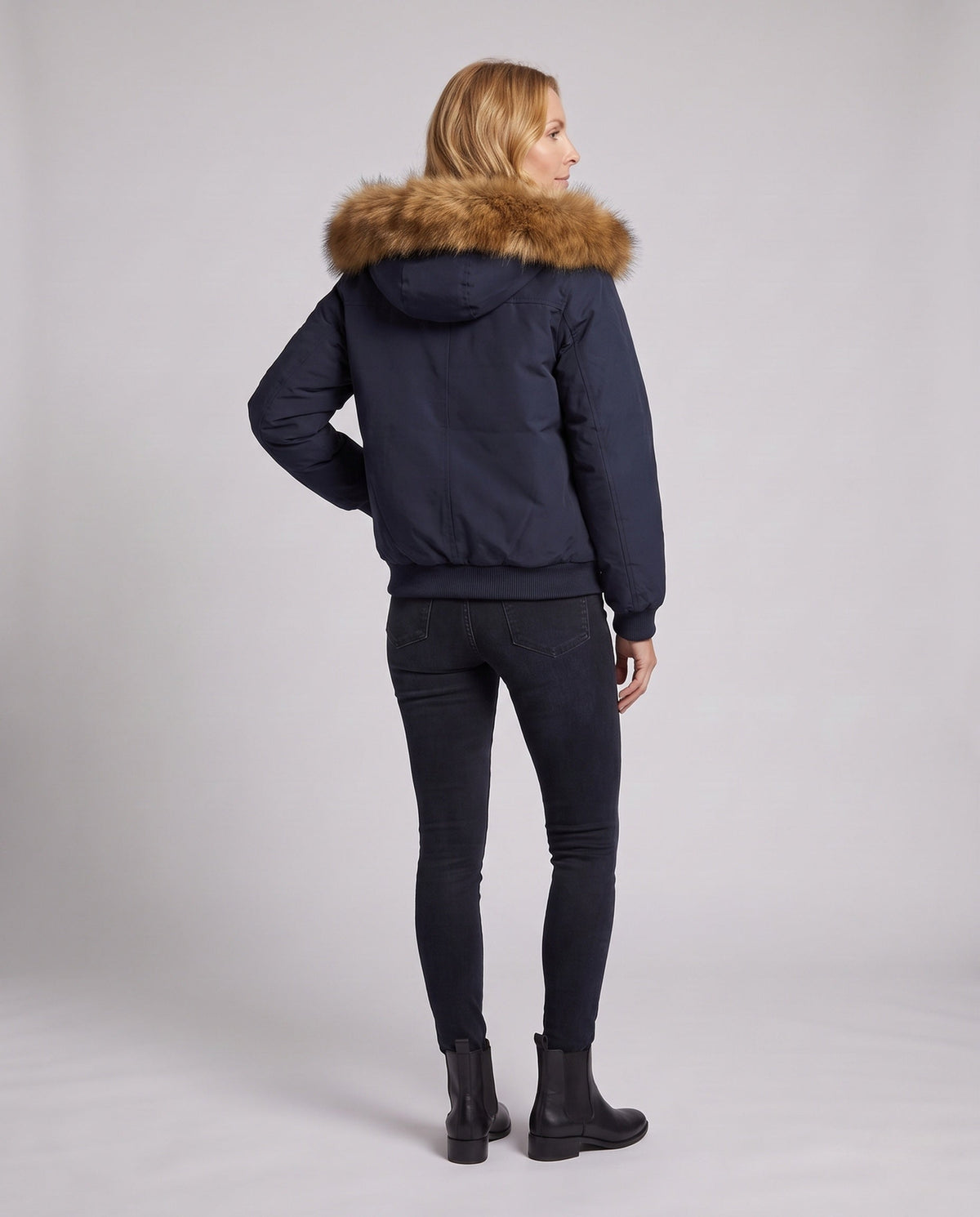 Women's short urban thermal parka with detachable faux fur trim, raglan sleeves, and concealed two-way zipper