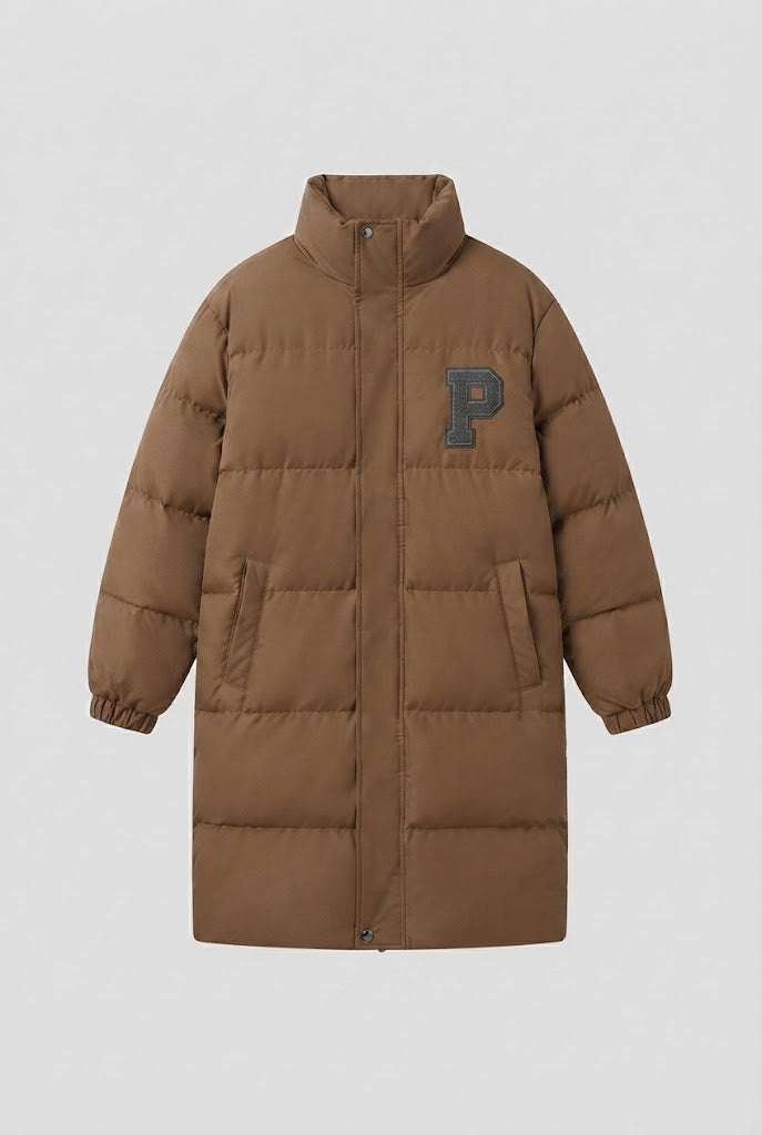 Women's longer boxy thermo puffer with high stand-up collar, college patch, and noise-reducing outer shell