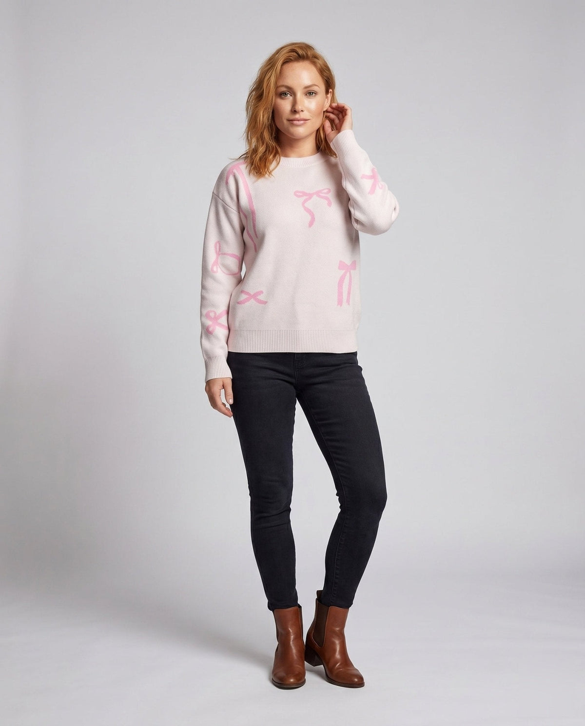 Women's knitted sweater with playful bow motifs - Chichicherry