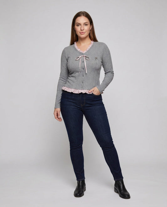 Women's long sleeve blouse with playful ruffled hem and decorative loop design - Chichicherry